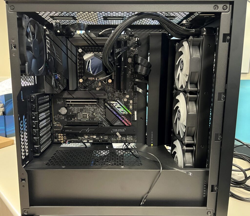 Custom PC build with liquid cooling radiator mounted and cables routed
